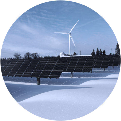 Wind turbines with solar panels in a snowy field (circle shape)